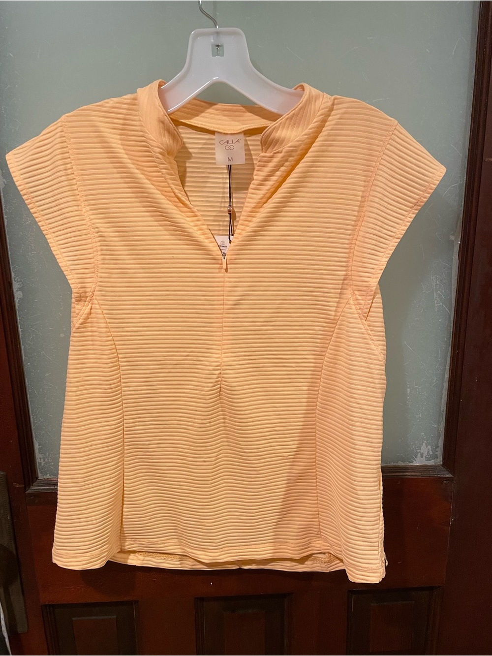 Calia Sleeveless Textured Zip-Front Top in Pale Peach